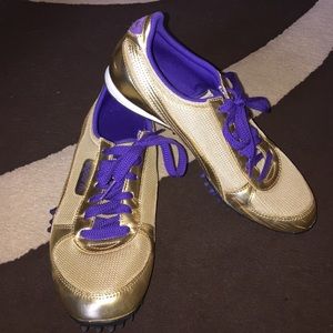 Puma gold and purple running shoes
