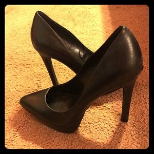 Black leather pumps