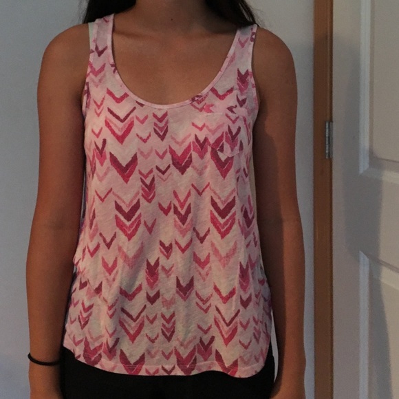 a chevron patterned pink tank top