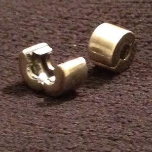 Authentic Pandora sterling silver clip charm.