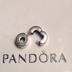 Authentic Pandora sterling silver clip charm.