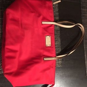 Kate spade tote bag in red with black interior.