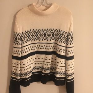 St. John cream sweater with sparking piates. St. John cream sweater with sparking piates.