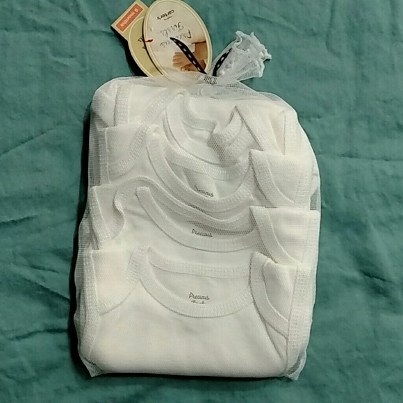 New with tags 4 pack sleeveless bodysuits 9M