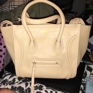 Tan phantom luggage tote