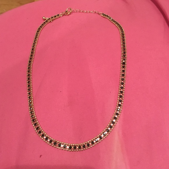 Short Gold necklace with black stones