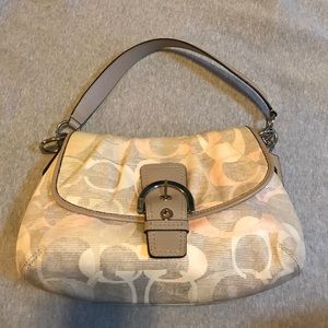 Women's pink and grey Coach purse