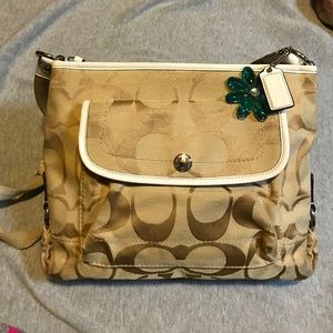 Women's light tan cross body Coach purse
