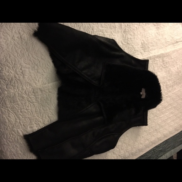 Suede vest fur lined.