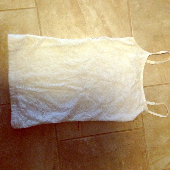 I am selling a White lace flower tank top.
