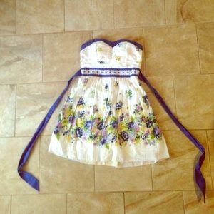 I am selling a strapless white flower dress.