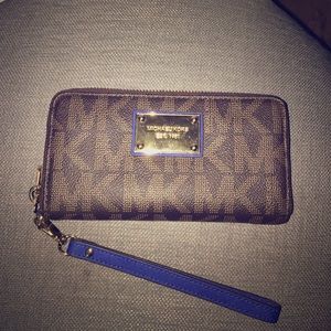 Brown Michael Kors wristlet with Blue strap