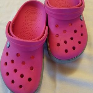 Girls clogs by Crocs .