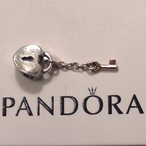 Authentic Pandora "Lock" charm with 14kt gold key.