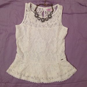 Garage: Peplum white sleeveless top