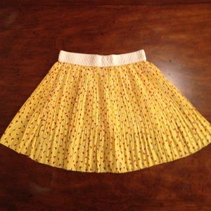 I am selling a yellow white and a red skirt.