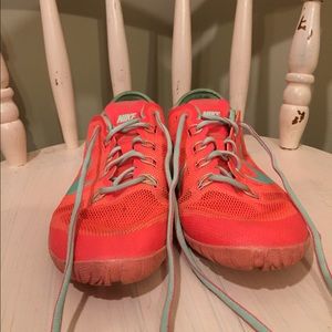 Neon Nike training shoes