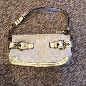White and gold coach purse