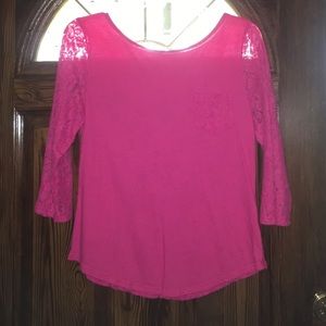 Pink top with lace sleeves and a lace back