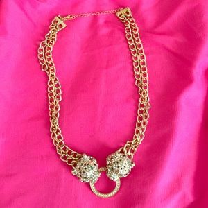 Gold lion necklace.