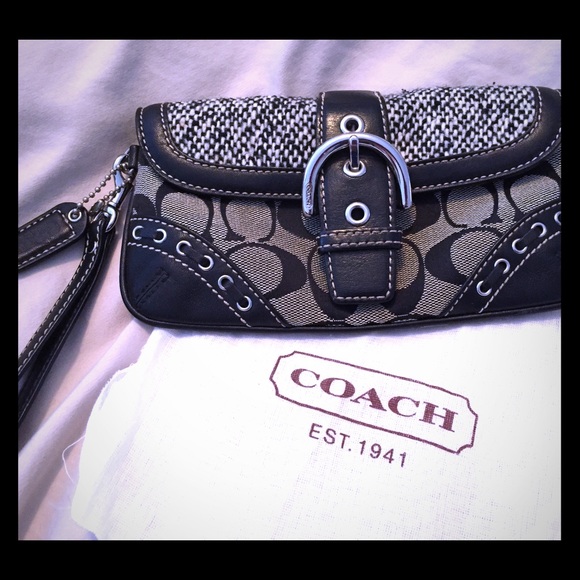 Unique black and white Coach wristlet purse