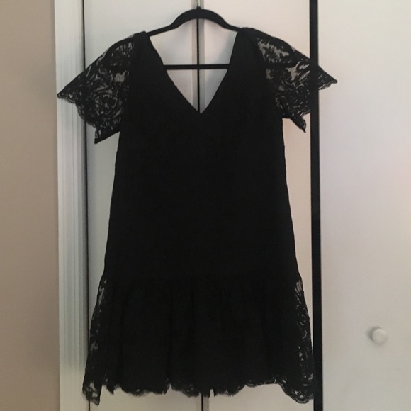Short lace blk dress with soutache detail.