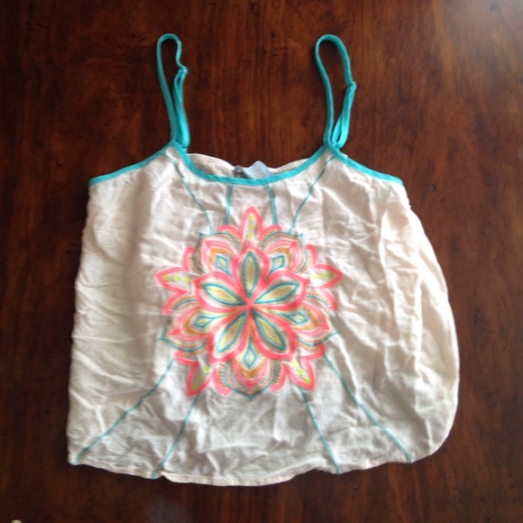 I am selling a White flowered tank top.