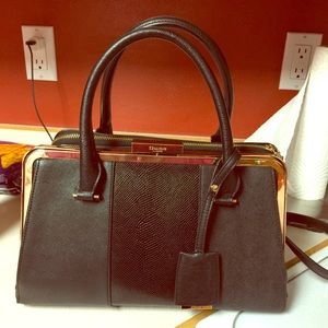 Black and gold Dune London bag