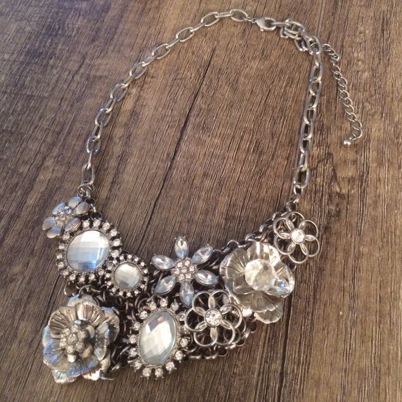 silver statement necklace with flower/gem details
