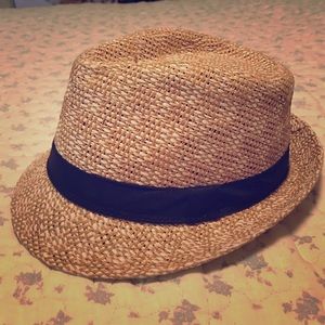 Brown sandy color fedora with black accent