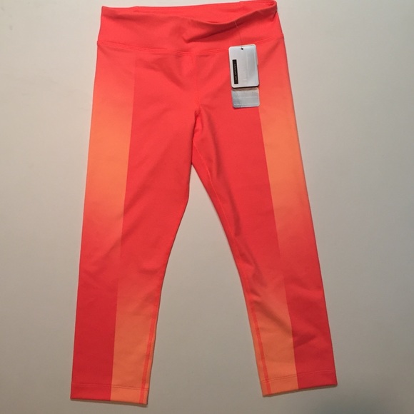 NWT UnderArmour neon orange workout pants size s