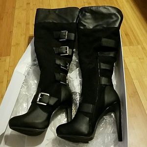 Brand new never worn heeled knee high boots.