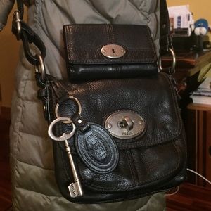 Fossil crossbody purse with matching wallet.