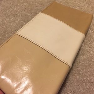 Leather clutch dezaria brand tan and white