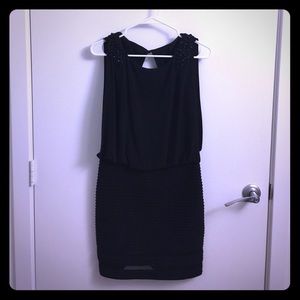 Black cocktail dress with lots of details