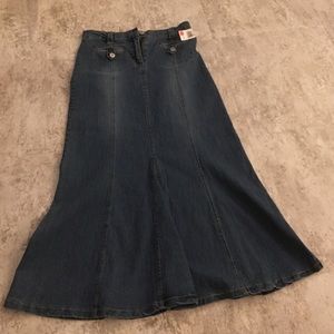 A maxi length blue jeans skirt