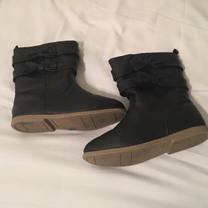 Little girl ridding boots