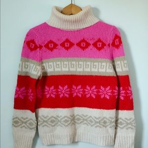 Oversized pink, cream and red sweater.