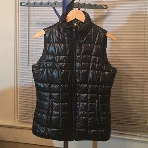 Black quilted vest by Lole, size small, 4-6.