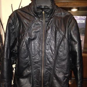 Leather jacket with spiral stitching detail.