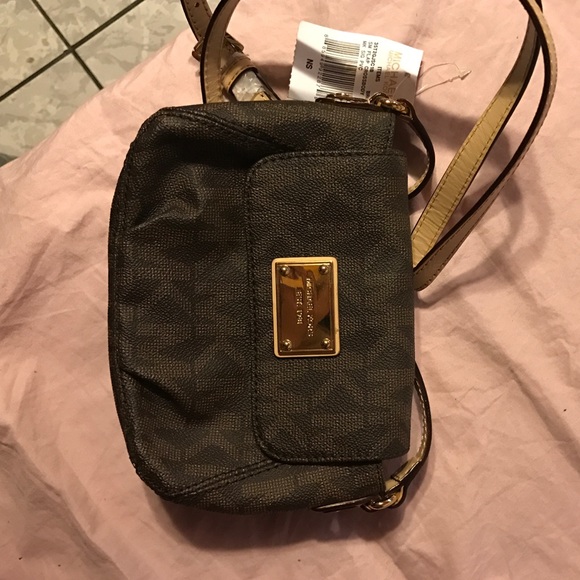 Michael Kors small flap crossbody purse.
