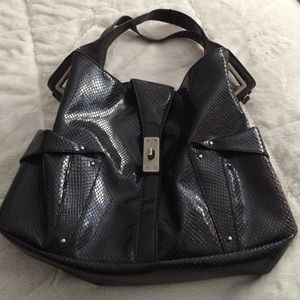 Jessica Simpson black faux snakeskin purse.