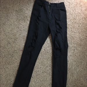 Black distressed and ripped jeans