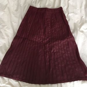 Maroon piped skirt.