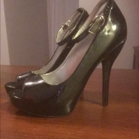 Black peep toe heels. With ankle strap.