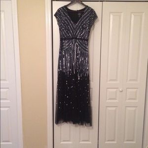 Adrianna Papell beaded v-neck gown.