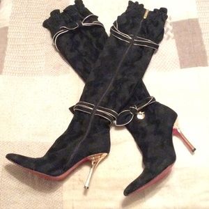 Thigh high heel boots.