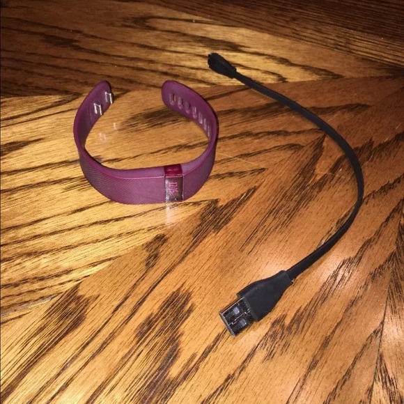 Women's size small burgundy Fitbit with charger