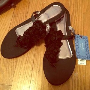 Black rose flip flop sandals.