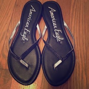 Black glitter flip flops.